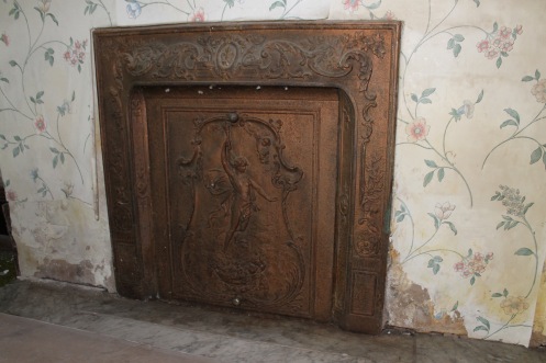 Close-up of dining room fireplace. This one may have to be moved.