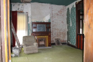 Living room. Original fireplace, brick walls, lots of original woodwork.